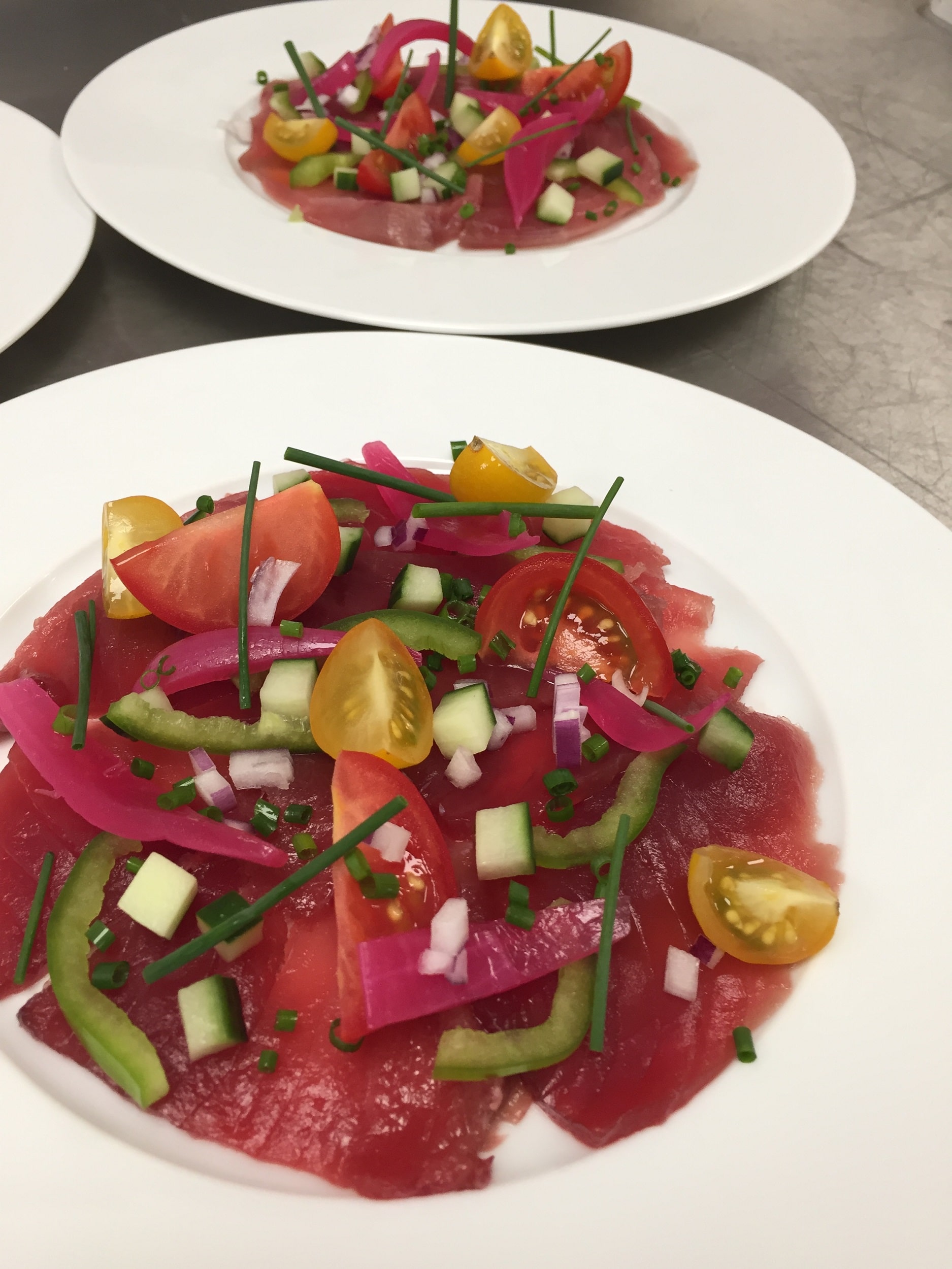 Mediterranean red tuna in carpaccio and condiments.